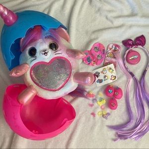 Rainbocorn stuffed animal with hair accessories, stickers, and other extra toys
